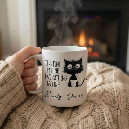cat-humor-mug-white-ceramic-mug-held-near-fireplace-sku-de251208152820